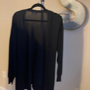 Long sweater with cute shoulder detail.